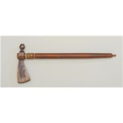 Pipe tomahawk of unknown age with dark patina  on iron head, plain wood shaft with brass  tack decor