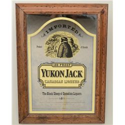 Framed Yukon Jack Canadian Liqueur bar mirror  in overall good condition approx. 26” x 19”.   Est.: 