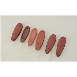 Lot of 6 Winchester and Hawkins red hard  rubber recoil pads.  Est.:  $50-$75.