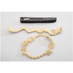 Lot of two carved ivory pieces including a  finely accomplished mythical oriental dragon  approx. 10