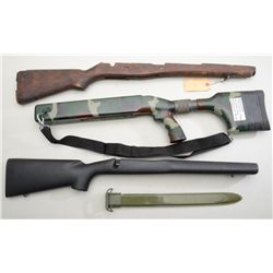 Lot of three rifle stocks and a reproduction  U.S. ’03 bayonet scabbard including a black  composite