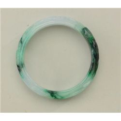 Finely carved jadeite bangle bracelet  untreated. Est. $300-$400