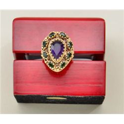 One 14k yellow gold antique ring set with a  pear shaped amethyst and emeralds. Gold  weight 11.3 gr