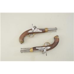 Pair of antique percussion single shot  pistols in custom modern wood case with  carved game scene o