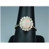 Image 1 : Elegant 14 karat yellow gold ladies ring set  with an Australian opal weighing approx. 3.00  carats 