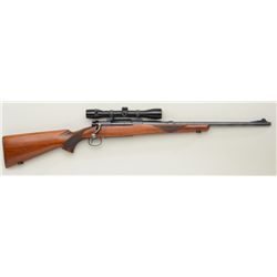 Winchester Model 54 bolt-action rifle, 7mm  cal., 20” barrel, blue finish, checkered wood  stocks, c