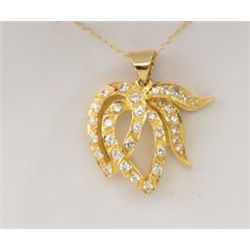 Floral design pendant in 14k yellow gold, set  with round diamonds weighing approx. 1ct.  Est. $750-