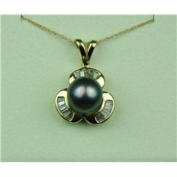 High quality 14 karat yellow gold ladies  necklace set with a round black pearl  averaging 9.00 MM i