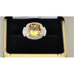 One ladies ring in 10k white gold set with a  cushion cut citrine and diamonds. Est.  $500-$600