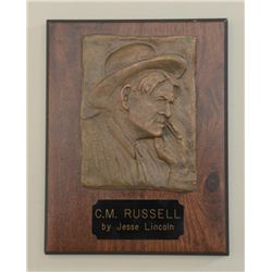 Cast bronze relief of Charlie Russell on wood  plaque by Jesse Lincoln; approx. 4-1/4” x 6”  and nic