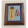 Image 1 : Framed and matted display of two early  reception ribbons/pins for Cowboy and Actor  Tim Holt, one i