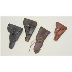 Lot of four misc. military holsters including  a US 1911 leather flap holster in fair  condition mar