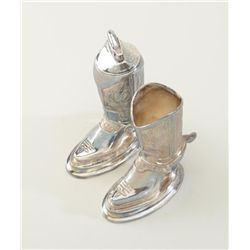 Silver plated cast metal cigarette set in the  shape of fancy cowboy boots including one  boot as a 