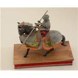 Desk-size display of a Medieval Knight in  armor on horseback, approx. 11” in height and  approx. 12