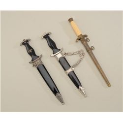 Lot of three reproduction nazi daggers with  sheaths.  Est.:  $100-$300.