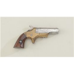 Southerner single shot derringer, .41 cal.,  2-1/2” barrel, brass frame, wood grips,  #8596. This gu
