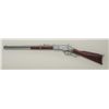 Image 2 : Reproduction of a Winchester Model 1873 lever  action SRC, cast metal with wood stocks.  This non-gu