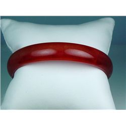 Splendid ladies red Jade bangle. Retail  $995.00 Estimate $300-$500