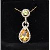 Image 1 : Beautiful pendant in 10k yellow gold set with  a pear shaped citrine diamonds and a  peridot. Est. $