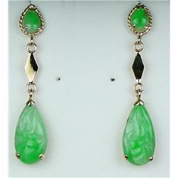 Elegant 14 karat yellow gold ladies drop  earrings set with four matching nice green  Jade weighing 