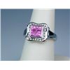 Image 2 : Stylish 10 karat white gold ladies ring  invisible set with four pink sapphires and  channel set wit