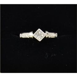 Diamond ring in 18k white gold set with  princess cuts and rounds weighing .42ct. Est.  $1,000-$1,25