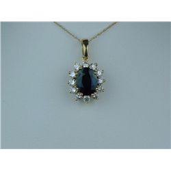 Gorgeous 14 karat yellow gold ladies pendant  set with an oval blue sapphire weighing  approx. 2.00 