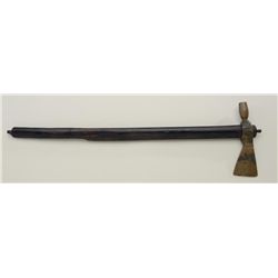 Tomahawk peace pipe with brass head and brown  stained stem measuring almost 24" overall.   Brass he