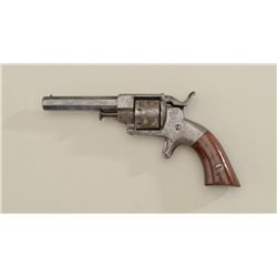 Allen & Wheelock side hammer .22 cal,  7 shot  revolver, with roll-engraved cyl.  blue  finish, wood