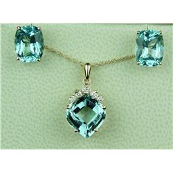 Splendid 14 karat yellow gold ladies  pendant/earrings ensemble set with three  matching Aquamarines