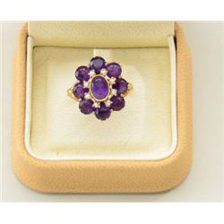 One antique ladies ring in 14k rose gold set  with amethyst and pearls. The ring is hand  crafted in