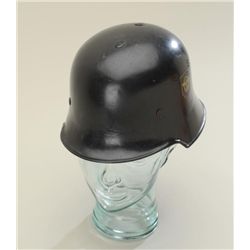 A German Police helmet showing 2 decals  original liner and chin straps intact.  Interior ID'd in pe