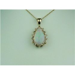 Elegant 14 karat yellow gold ladies pendant  set with an Australian opal weighing approx.  2.00 cara