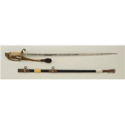 U.S. Naval dress sword and scabbard inscribed  to Russell D. Trout; sword blade is overall  very goo