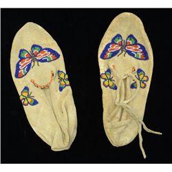 Beaded Indian woman’s moccasins in butterfly  pattern; overall good condition and nicely  accomplish