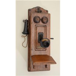 Monarch Telephone Mfg. in Fort Dodge, Iowa  showing oak case; brass bells and mounts.   Serial #L237