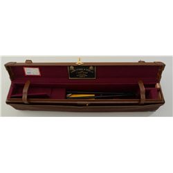 Beautiful leather shotgun case with canvas  cover showing James Purdey & Sons label in  lid and Ambe