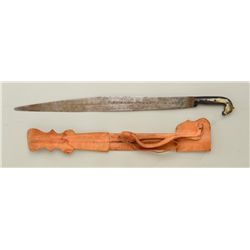 Mexican machete with leather sheath in  overall good condition; blade is inscribed  Todo Sera Vencin