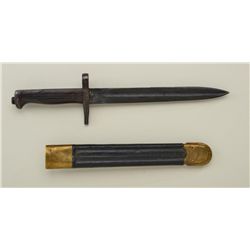 Shortened Italian 1870 bayonet with leather  sheath displaying brass tip and throat; both  in overal