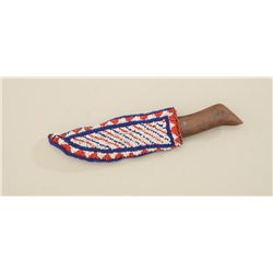 Indian beaded knife sheath, sinew sewn in  red, white and blue seed beads with old  scalping-type kn