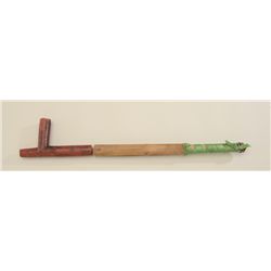 American Indian catlinite stone pipe with  raised carved wood stem approx. 27” overall  and approx. 