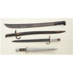 Lot of three European bayonets with metal  scabbards and a large machete without sheath;  all in fai
