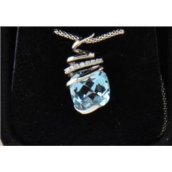 One beautiful cushion cut blue topaz and  diamond pendant set in 14k white gold. Est.  $450-$650