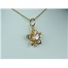 Gorgeous 14 karat yellow gold ladies flower  design pendant set with a round brilliant cut  diamond 