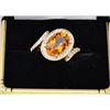 One ladies ring in 14k yellow gold set with a  5ct oval citrine and .25ct of fine diamonds.  Est. $1