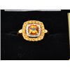 Image 1 : One ladies ring in 14k yellow gold set with a  cushion cut citrine, a row of round citrine  and a ro