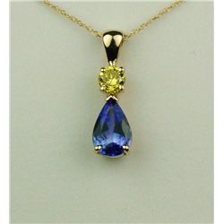 Vibrant 14 karat yellow gold ladies custom  made necklace set with a pear shape Tanzanite  weighing 