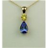 Image 1 : Vibrant 14 karat yellow gold ladies custom  made necklace set with a pear shape Tanzanite  weighing 