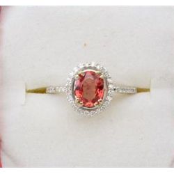 A 14k white gold ring set with an exotic  2.04ct orange sapphire or padparadsha (may be  enhanced) a