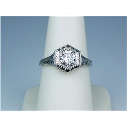 Stunning 18 karat white gold ladies vintage  design ring set with a fine round brilliant  cut diamon